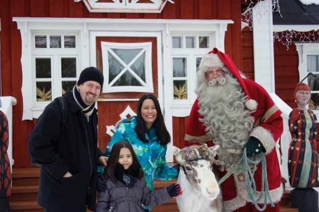 Our Family with Santa and one of his beautiful reindeer! I believe this may be a photo for our Christmas card this year!